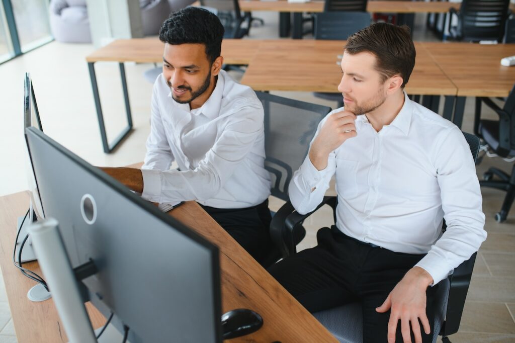 two employees discussing managed it security services